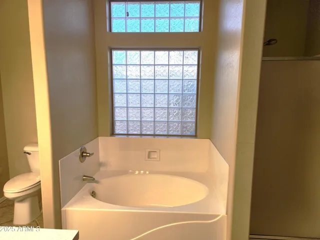 a bathroom with a sink and a large mirror