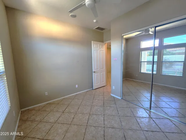 a bathroom with a sink mirror vanity and toilet
