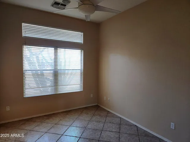 a view of a closet area with wooden floor
