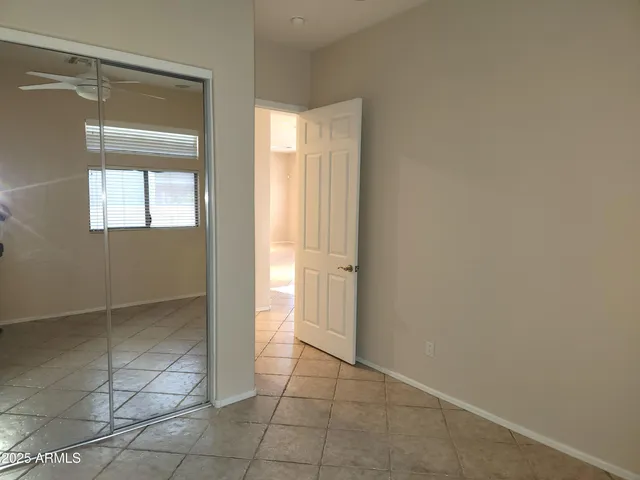 a bathroom with a sink vanity mirror and toilet