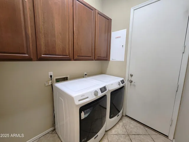 a view of a balcony with floor to ceiling window and a potted plant