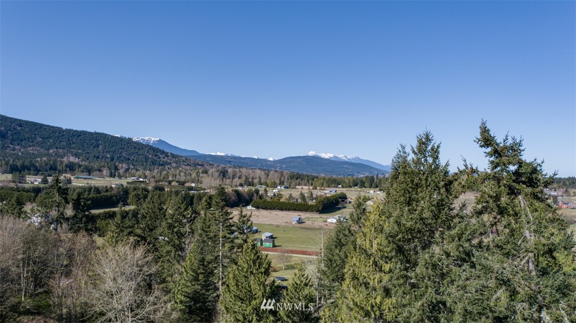 1 Fox Hollow Road Sequim, WA 98382 - Photo 20 of 20 a view of a lake with a mountain in the background