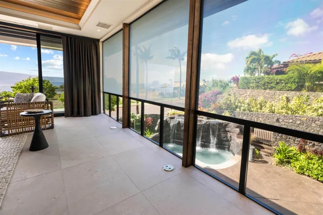 a view of a living room and balcony