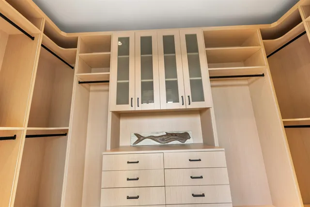 a spacious bathroom with a bathtub sink and mirror