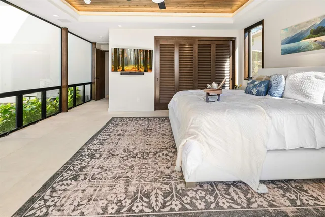 wooden floor in an empty room with glass windows