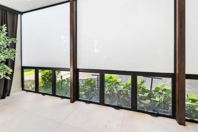 a bathroom with a shower and a mirror