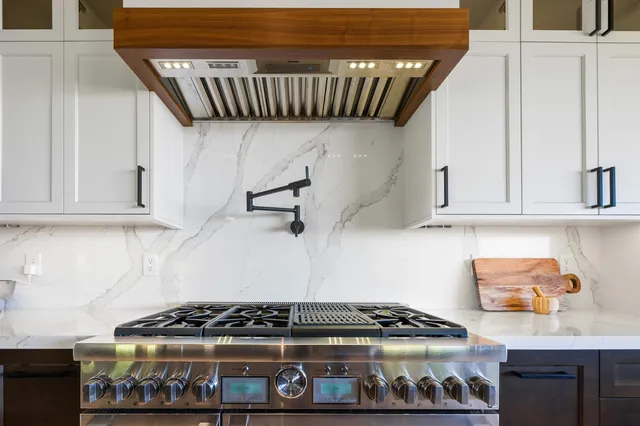 a kitchen with a stove and cabinets