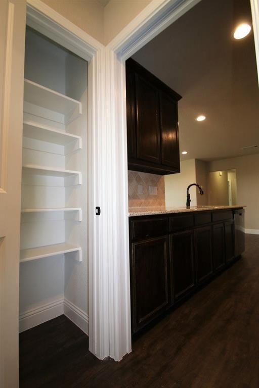 156 Crossbow Court Weatherford, TX 76088 - Photo 11 of 23 a view of a kitchen from the hallway