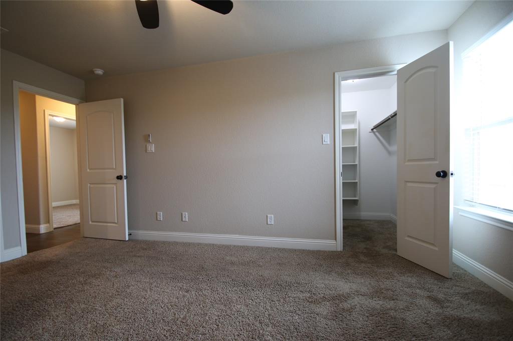 156 Crossbow Court Weatherford, TX 76088 - Photo 14 of 23 an empty room with closet and windows