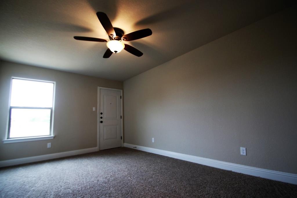 156 Crossbow Court Weatherford, TX 76088 - Photo 15 of 23 an empty room with windows and fan
