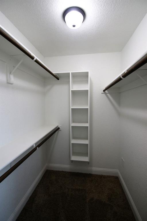 156 Crossbow Court Weatherford, TX 76088 - Photo 16 of 23 a view of a room with rack on the wall