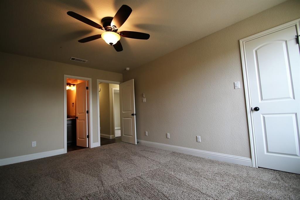 156 Crossbow Court Weatherford, TX 76088 - Photo 17 of 23 an empty room with closet and a ceiling fan