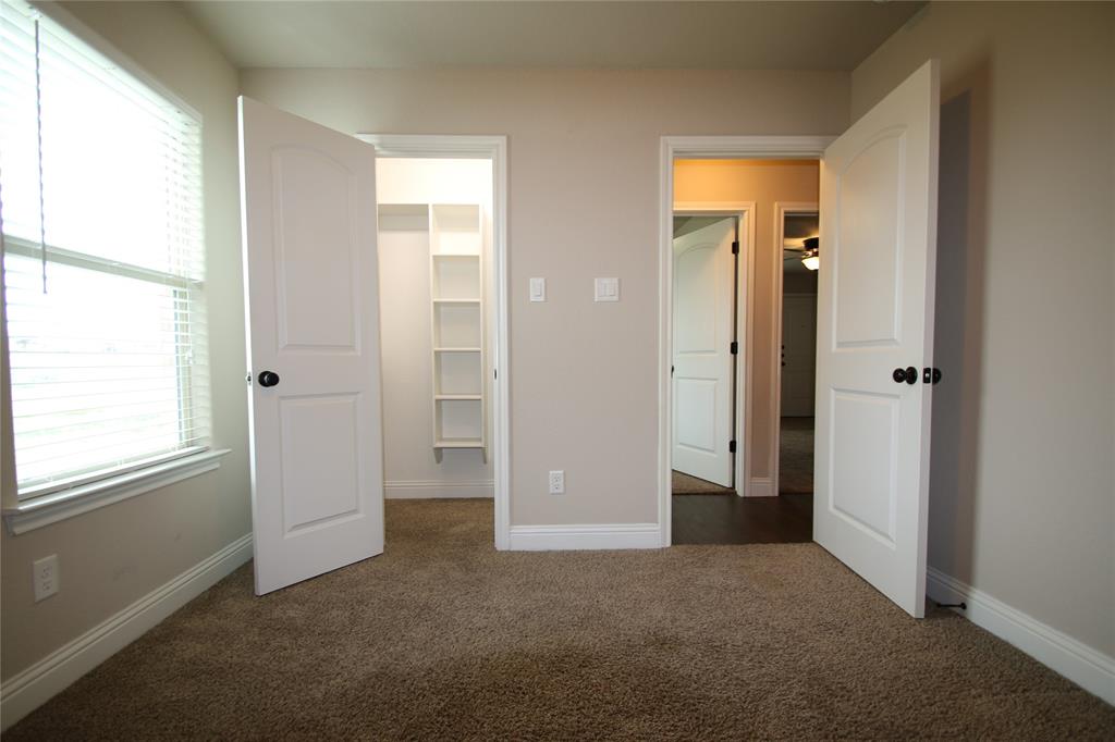 156 Crossbow Court Weatherford, TX 76088 - Photo 18 of 23 an empty room with windows and closet