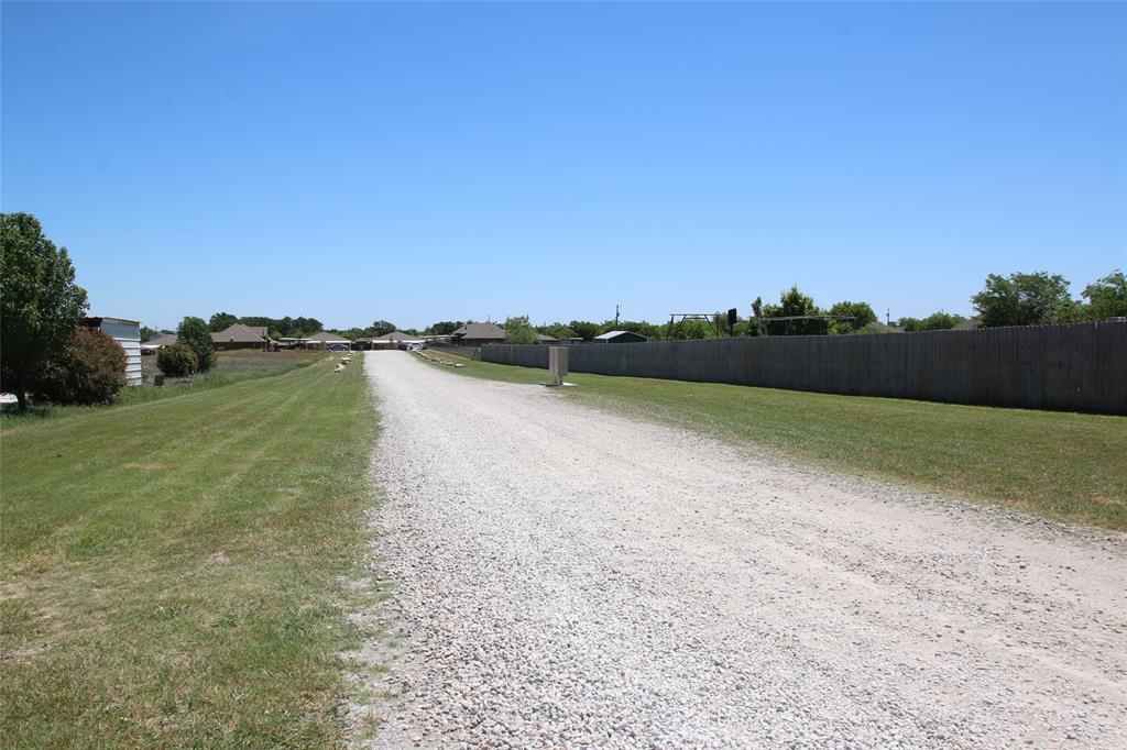 156 Crossbow Court Weatherford, TX 76088 - Photo 22 of 23 a view of a lake with houses in the background