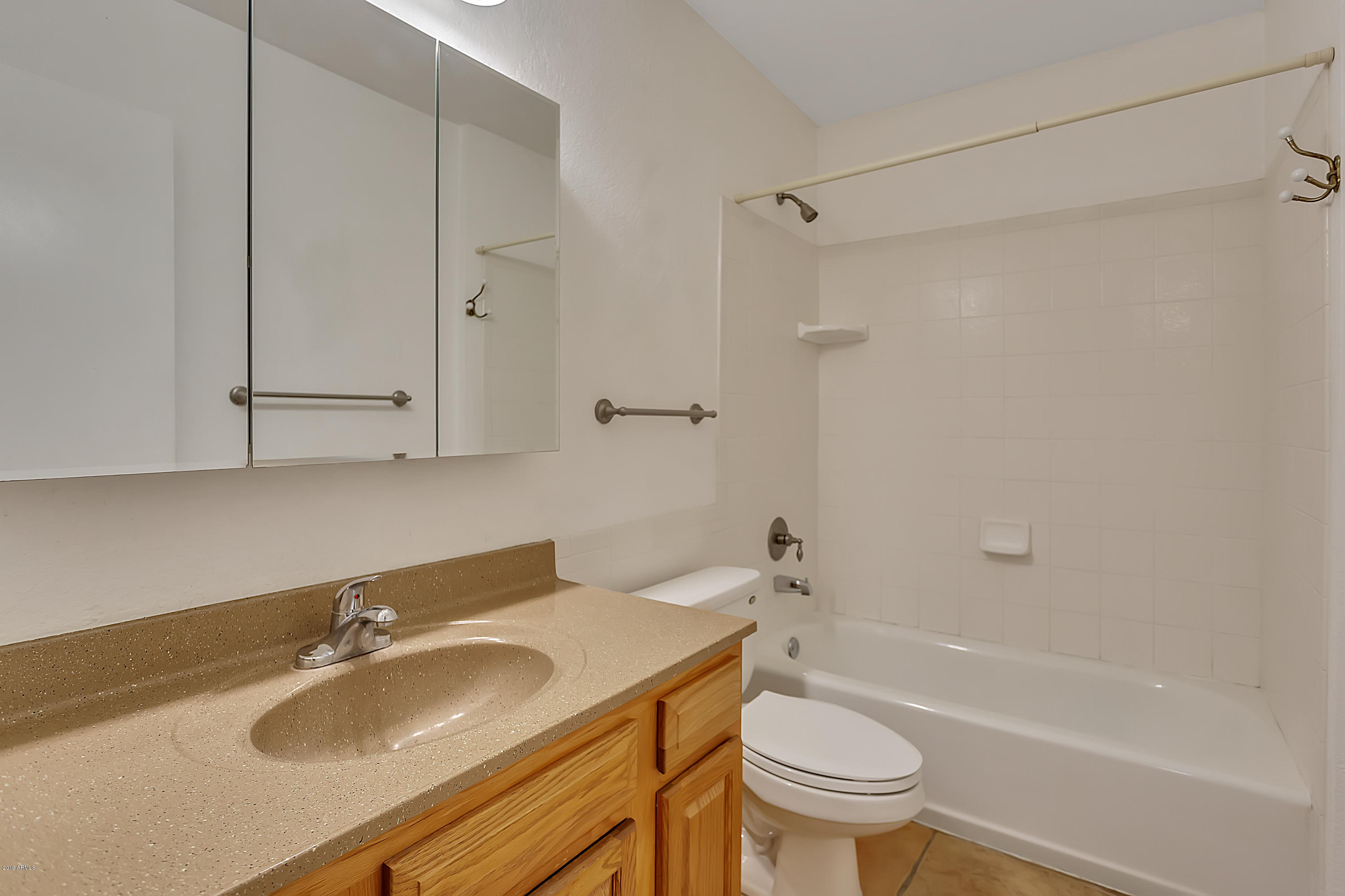9601 North 17th Place Phoenix, AZ 85020 - Photo 12 of 16 a bathroom with a sink toilet and shower