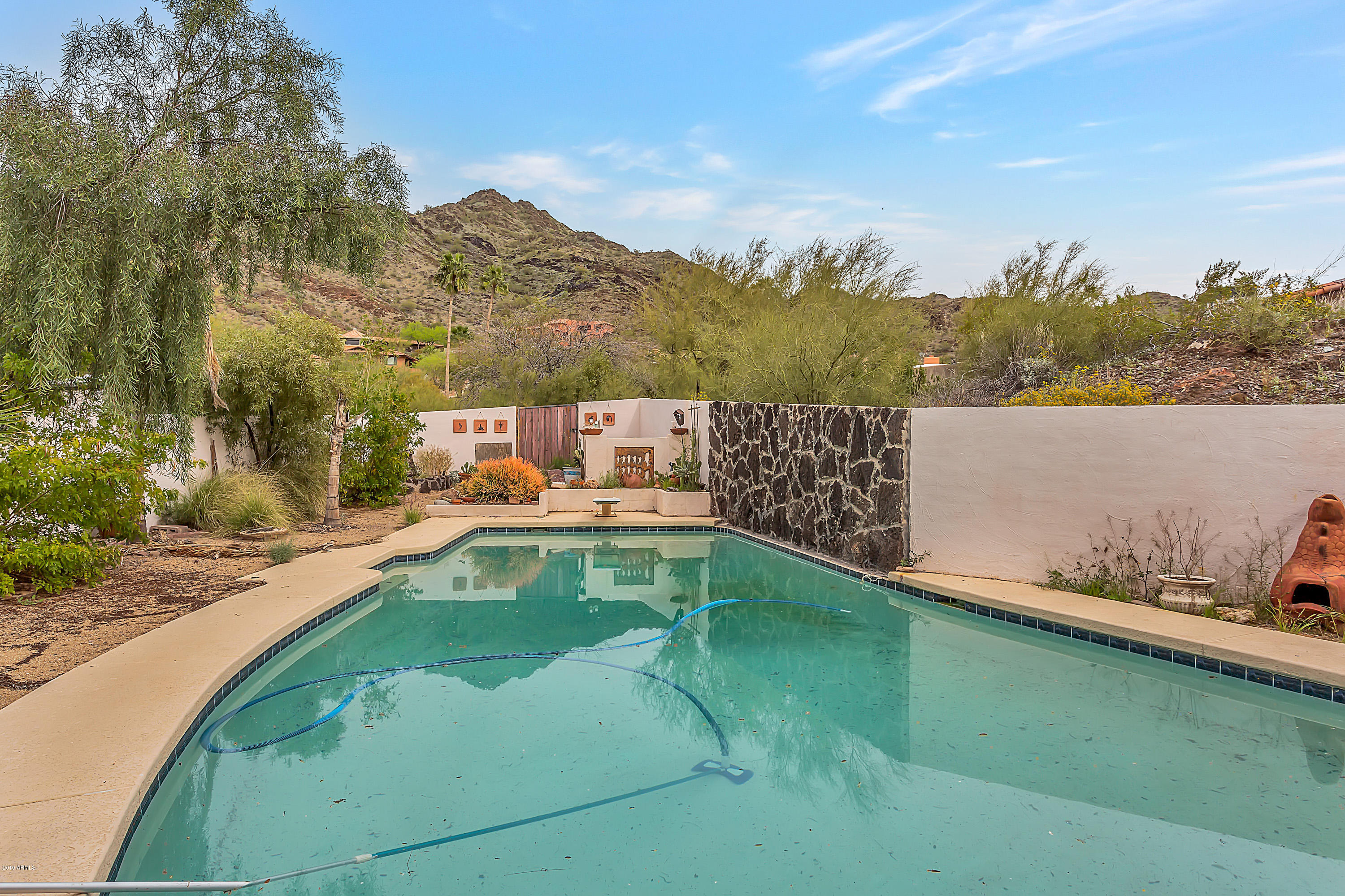 9601 North 17th Place Phoenix, AZ 85020 - Photo 16 of 16 a view of a swimming pool with a patio