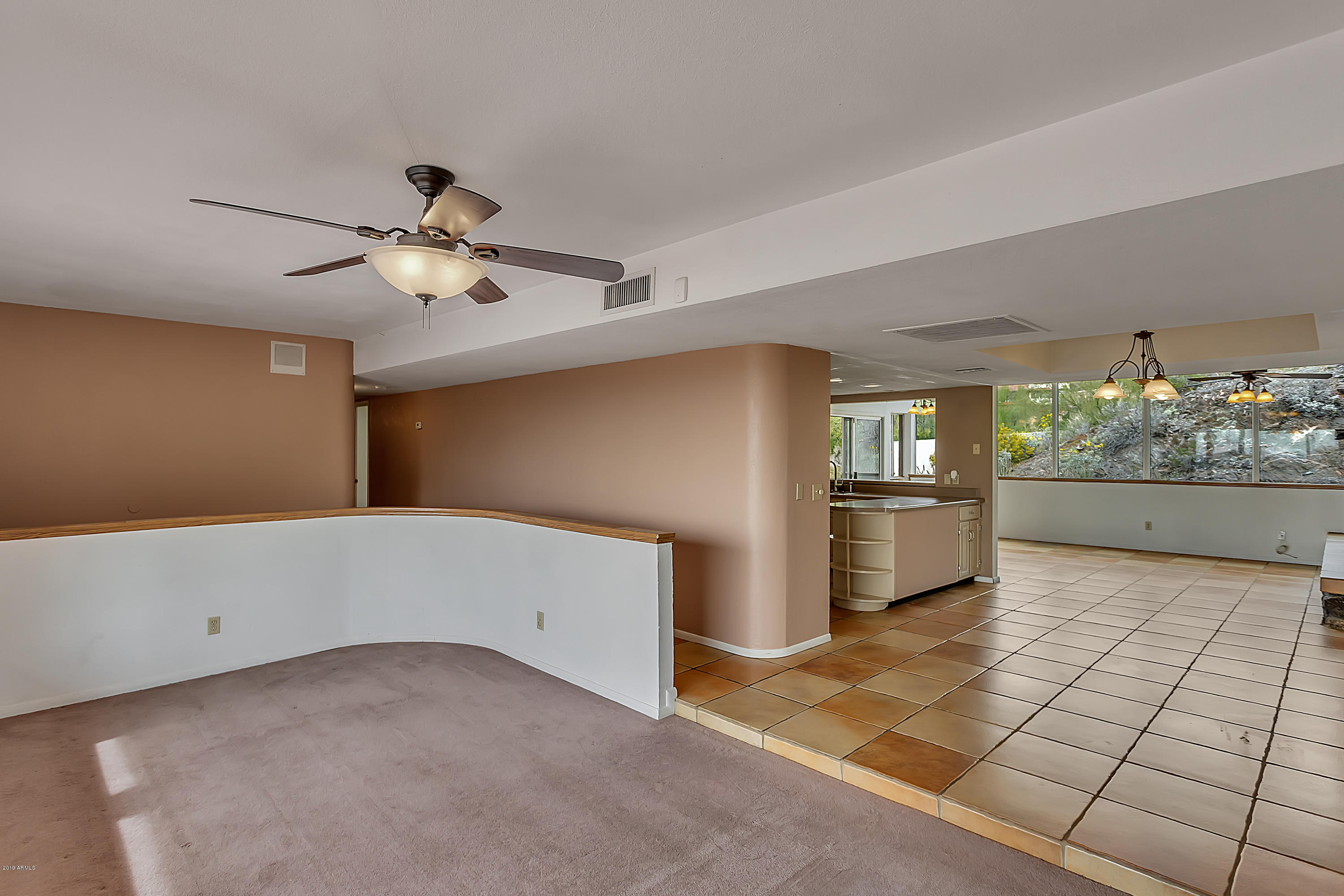9601 North 17th Place Phoenix, AZ 85020 - Photo 4 of 16 a view of a livingroom with wooden floor
