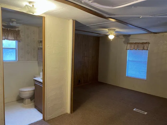 a view of a bathroom with a toilet
