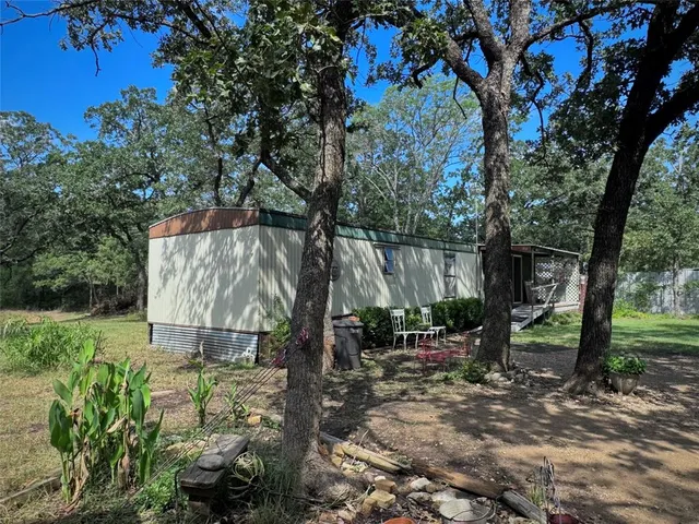 a backyard of a house with lots of green space