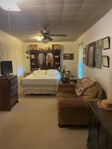 a spacious bedroom with a bed and furniture