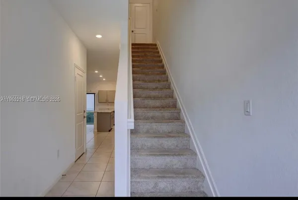 a view of a hallway with staircase