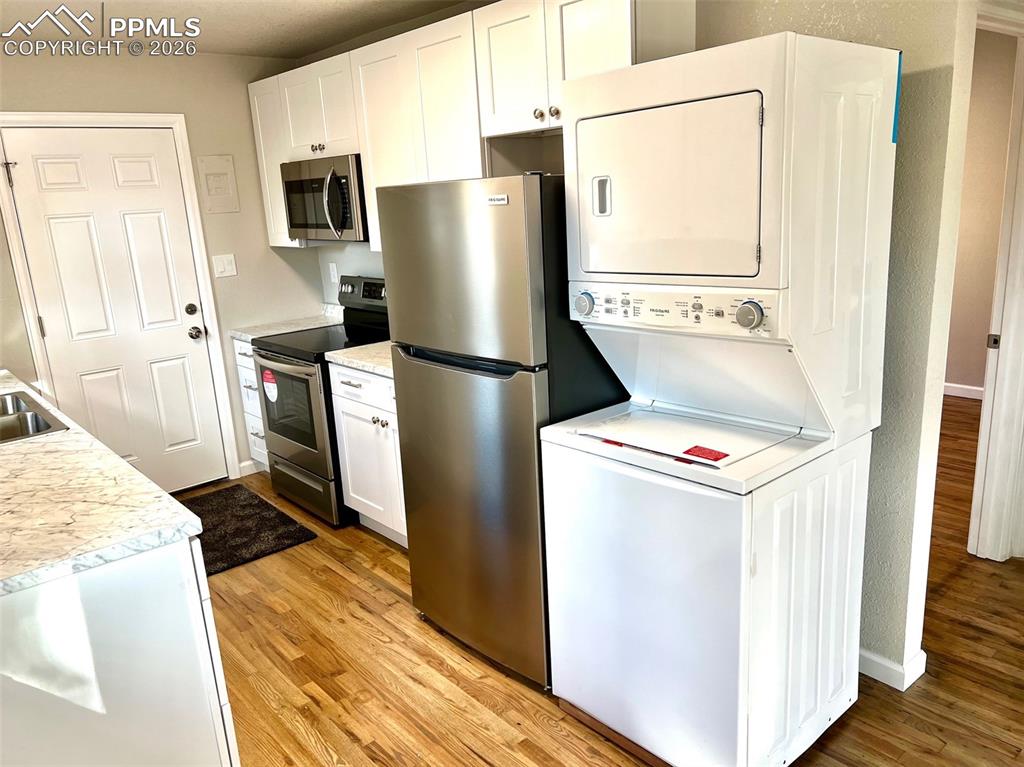 734 East Rio Grande Street Colorado Springs, CO 80903 - Photo 14 of 30 a utility room with dryer and washer