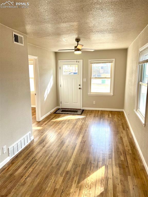 734 East Rio Grande Street Colorado Springs, CO 80903 - Photo 20 of 30 an empty room with wooden floor and windows