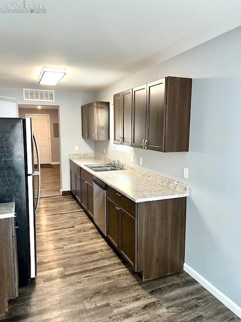 734 East Rio Grande Street Colorado Springs, CO 80903 - Photo 3 of 30 a kitchen with stainless steel appliances granite countertop a sink and a refrigerator