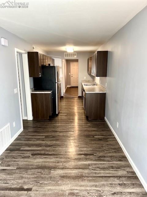 734 East Rio Grande Street Colorado Springs, CO 80903 - Photo 5 of 30 a view of a kitchen from the hallway