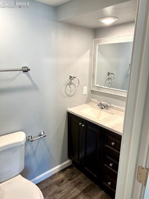 734 East Rio Grande Street Colorado Springs, CO 80903 - Photo 10 of 30 a bathroom with a sink vanity mirror and toilet