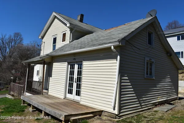 a view of a roof deck with wooden floor and fence