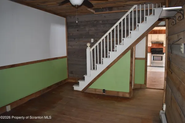a view of entryway with wooden floor