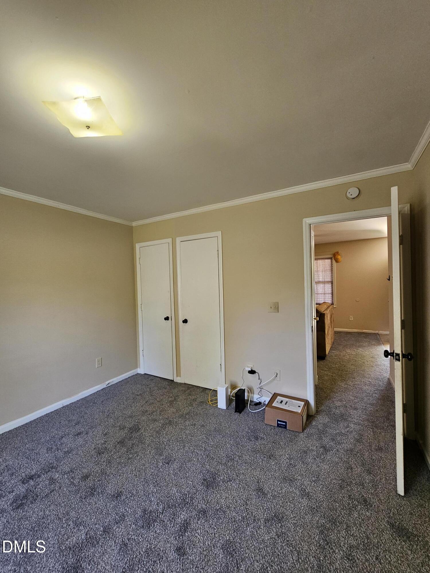 119 Lynn Drive Roxboro, NC 27573 - Photo 14 of 27 an empty room with closet and mirror