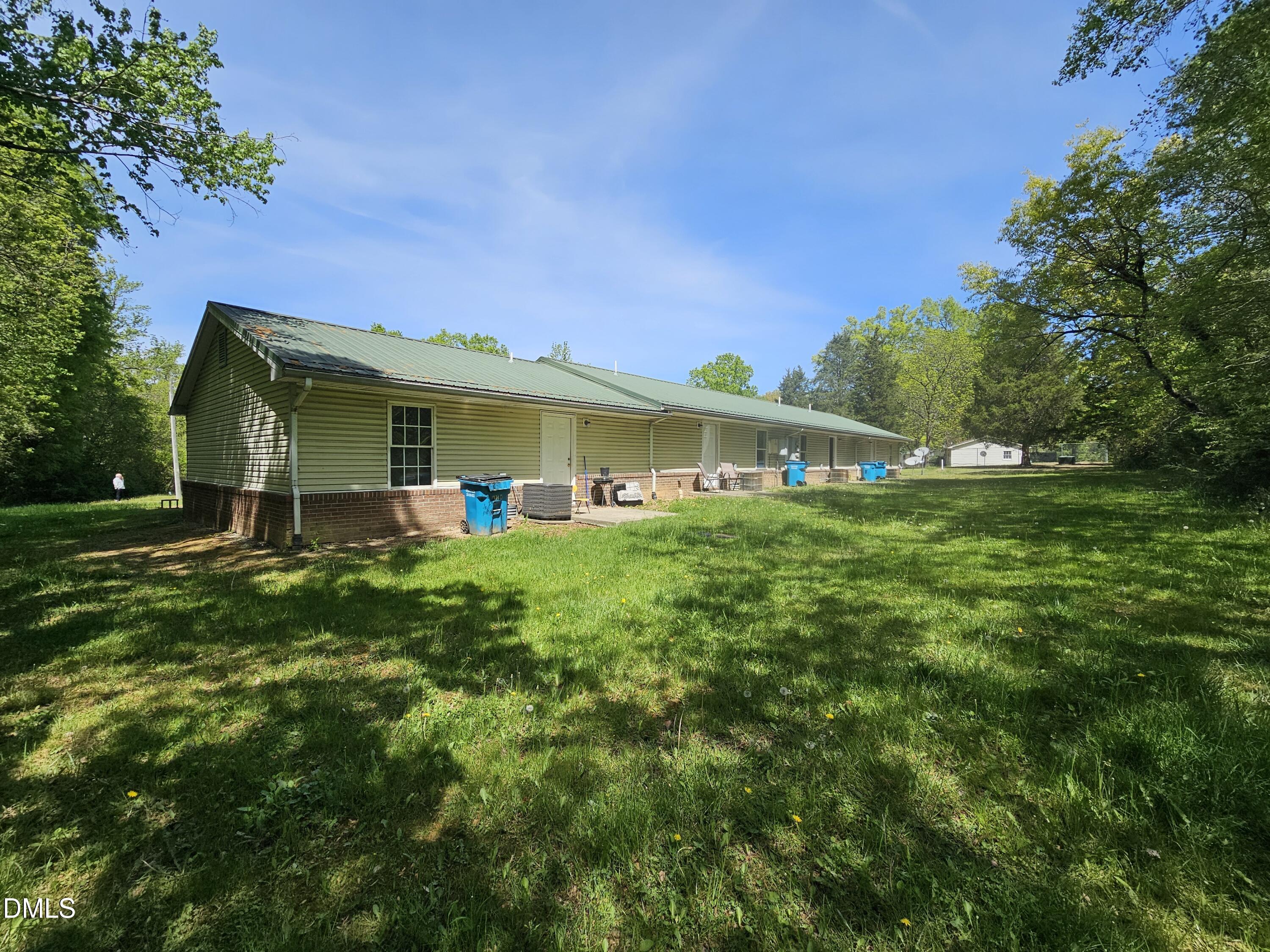 119 Lynn Drive Roxboro, NC 27573 - Photo 19 of 27 a front view of a house with a yard