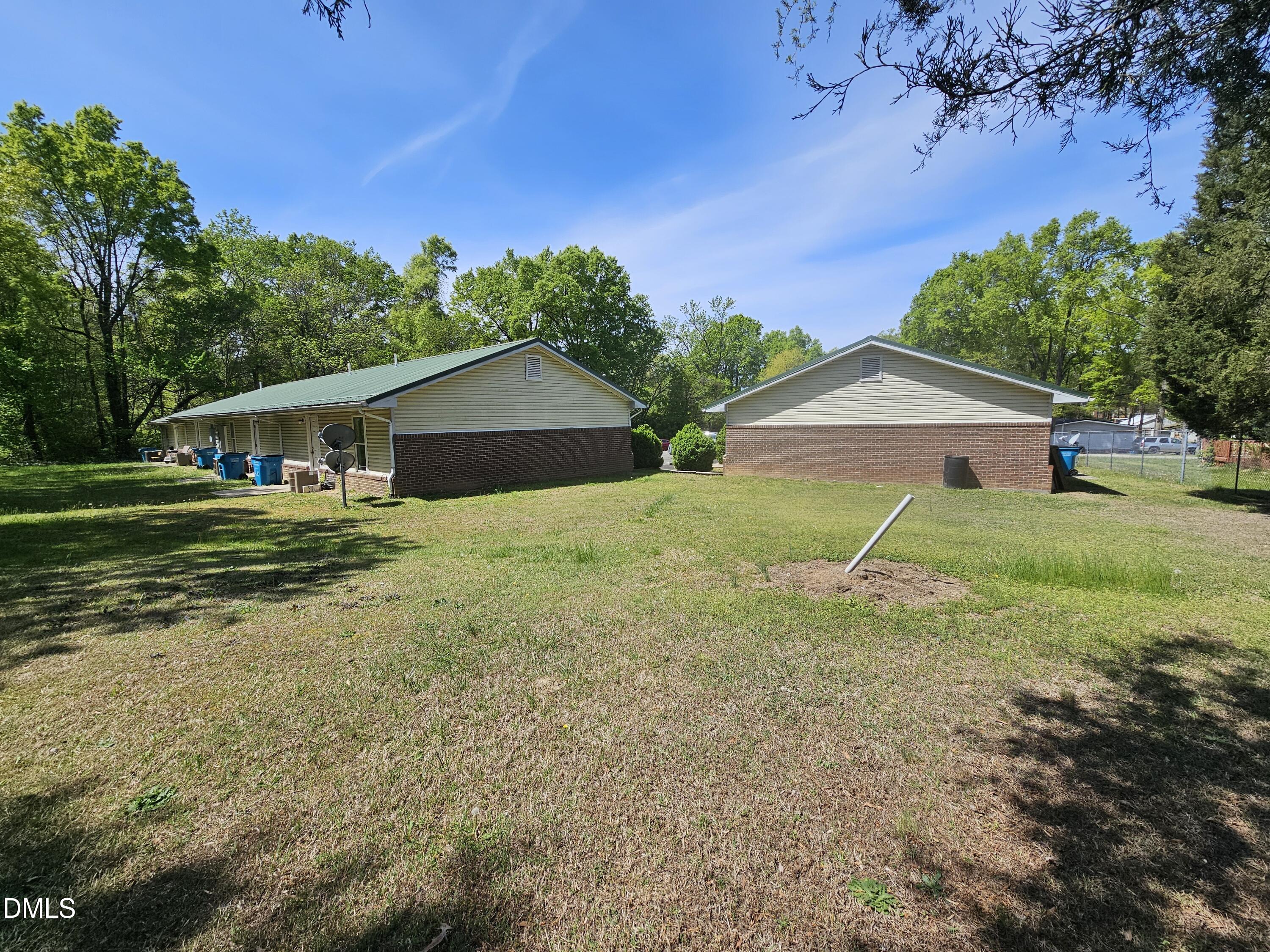 119 Lynn Drive Roxboro, NC 27573 - Photo 21 of 27 a view of a house with backyard and trees