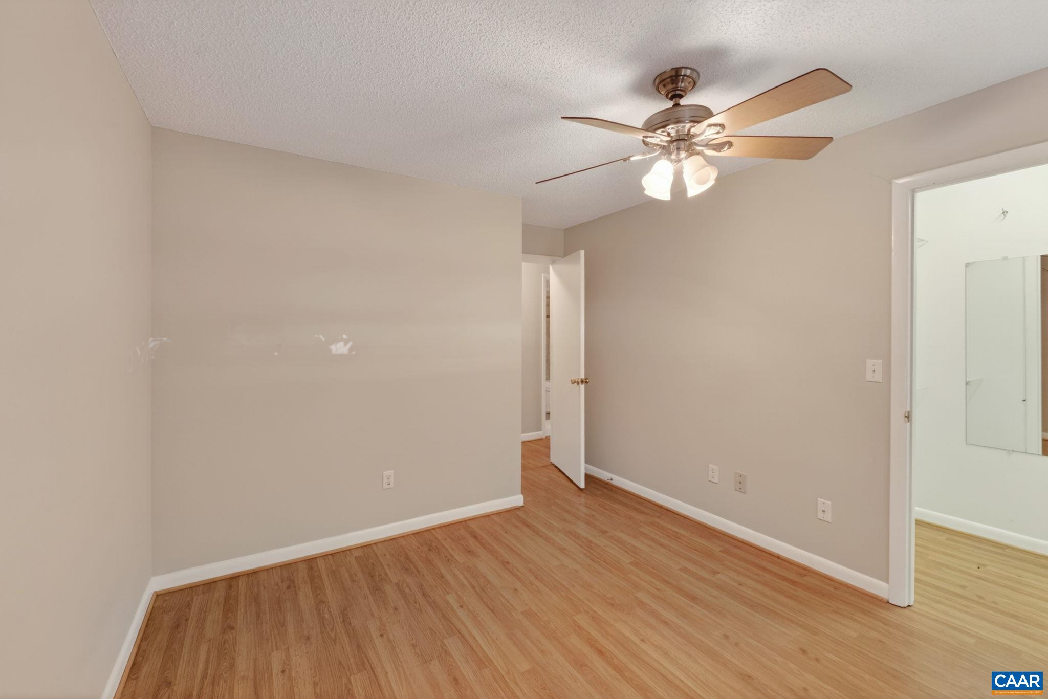103 Turtle Creek Road, Unit 8 Charlottesville, VA 22901 - Photo 19 of 37 wooden floor in an empty room with a window