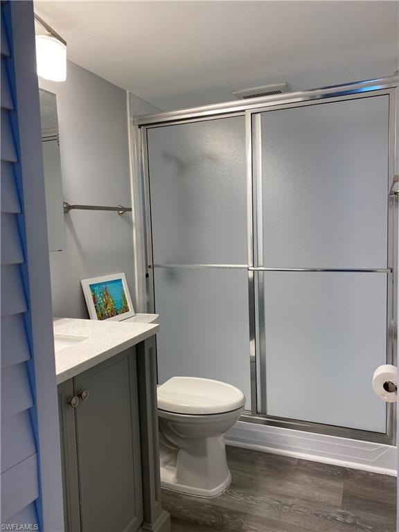 663 12th Avenue South, Unit 663 Naples, FL 34102 - Photo 2 of 5 a bathroom with a toilet and a shower