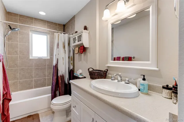 a bathroom with a sink a toilet and a bathtub