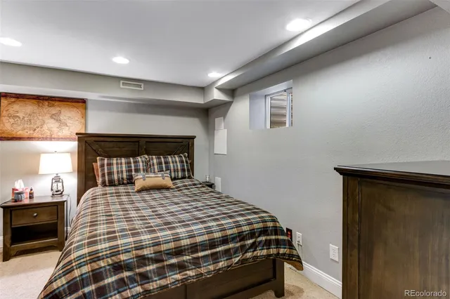 a bedroom with a bed and window