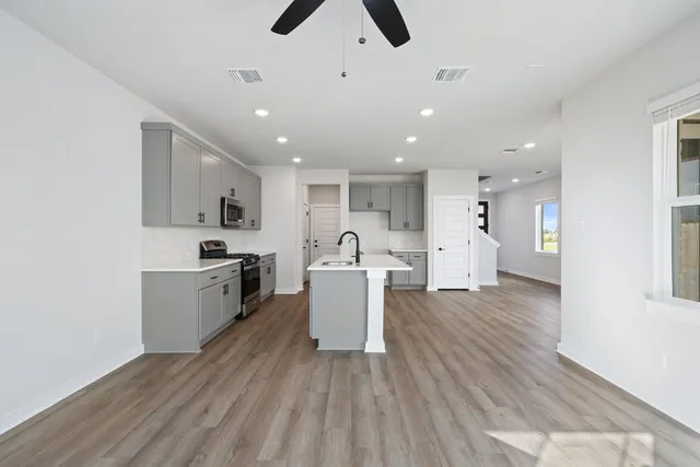 a view of kitchen with cabinets and stainless steel appliances