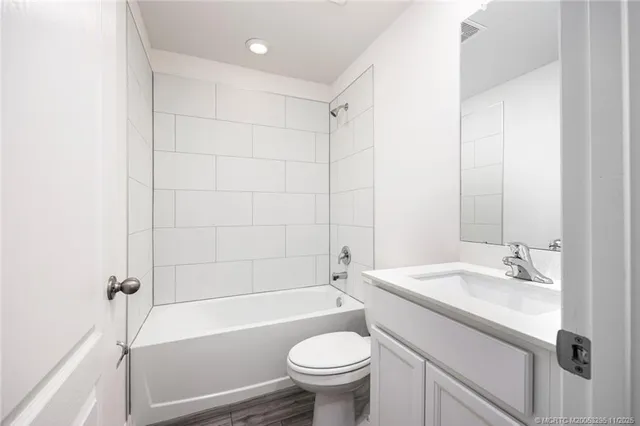 a bathroom with a sink a toilet and a bathtub