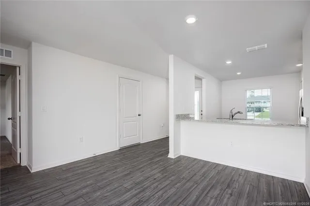 a view of kitchen and wooden floor