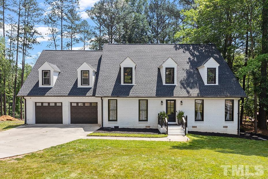 11804 Old Creedmoor Road Raleigh, NC 27613 - Photo 1 of 36 a house that has a big yard in front of it