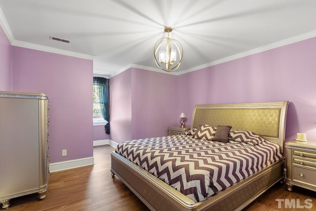 11804 Old Creedmoor Road Raleigh, NC 27613 - Photo 23 of 36 a bedroom with a bed and a window