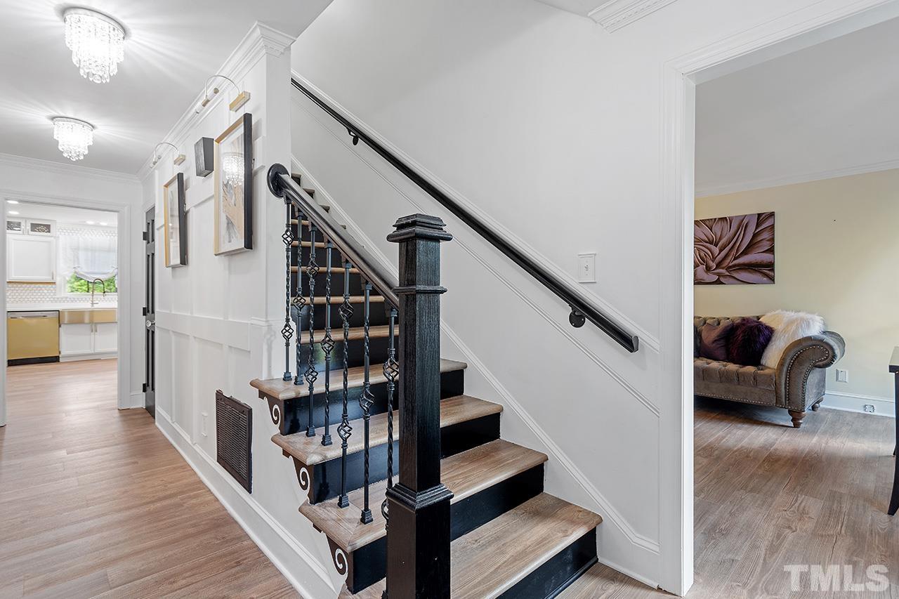 11804 Old Creedmoor Road Raleigh, NC 27613 - Photo 5 of 36 a view of entryway and hall with wooden floor