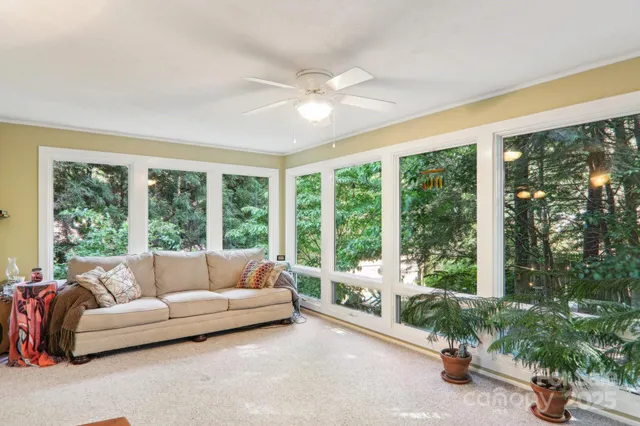 a living room with furniture and windows