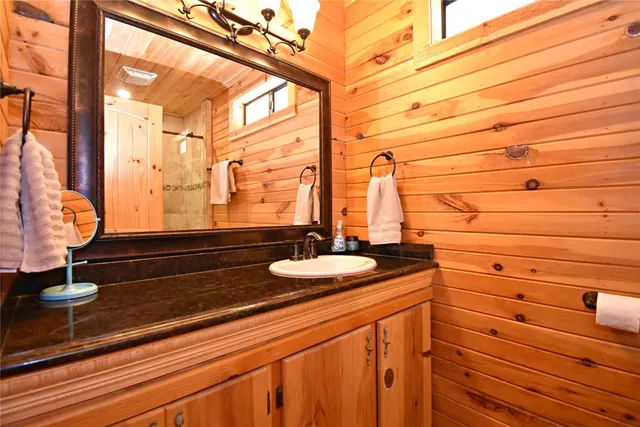 a bathroom with a sink and mirror