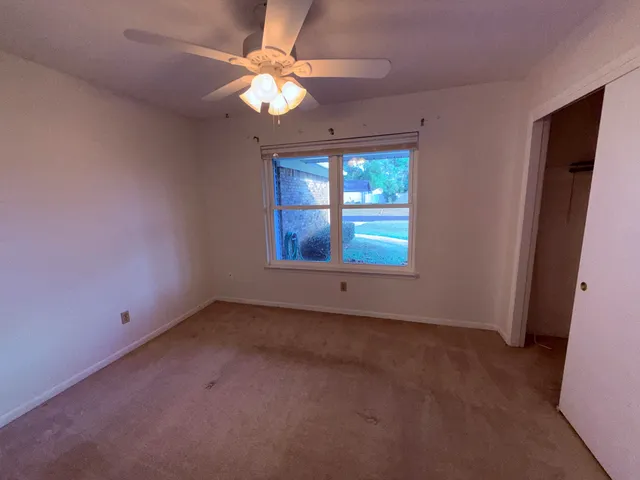 a view of livingroom with furniture wooden floor and window