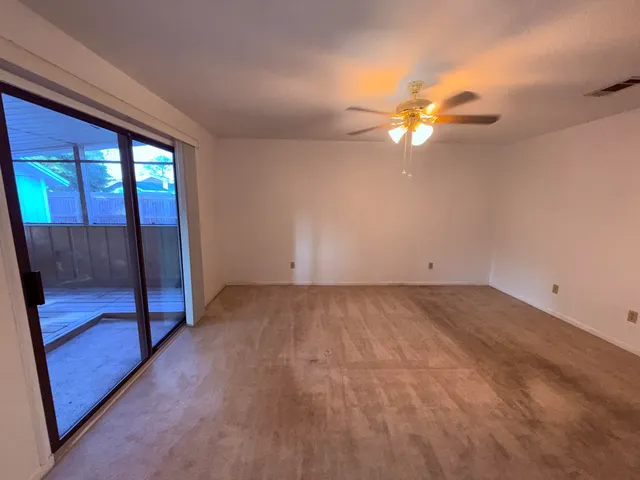 a view of a yard with swimming pool