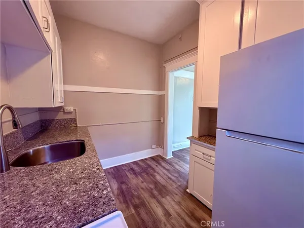 a view of front door with wooden floor
